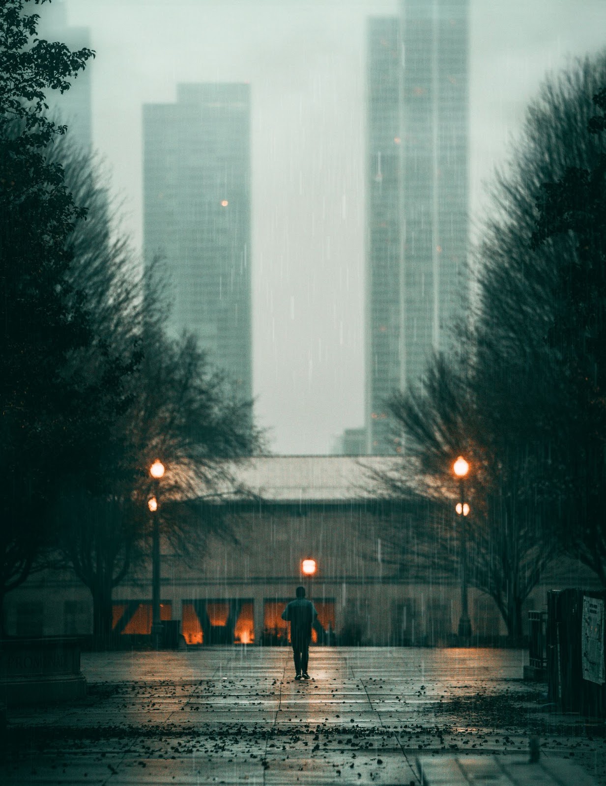 rainy day photograph of man in rain