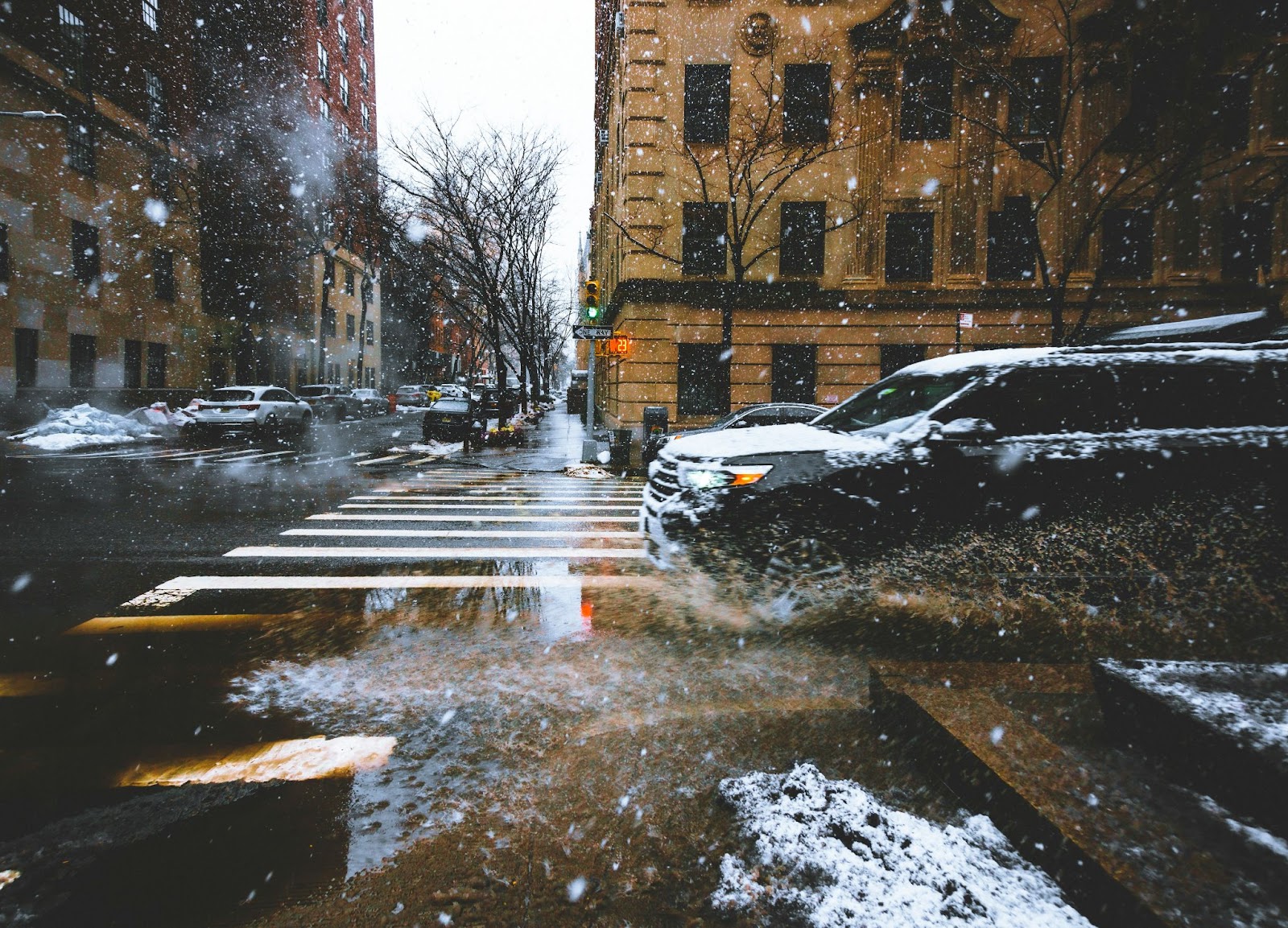 rainy day photography of car splashing puddle 