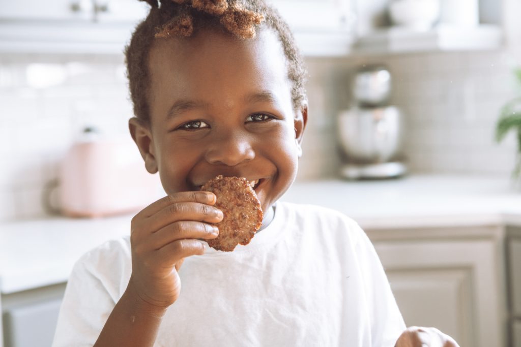 Family Photoshoot with a kid holding a cookie