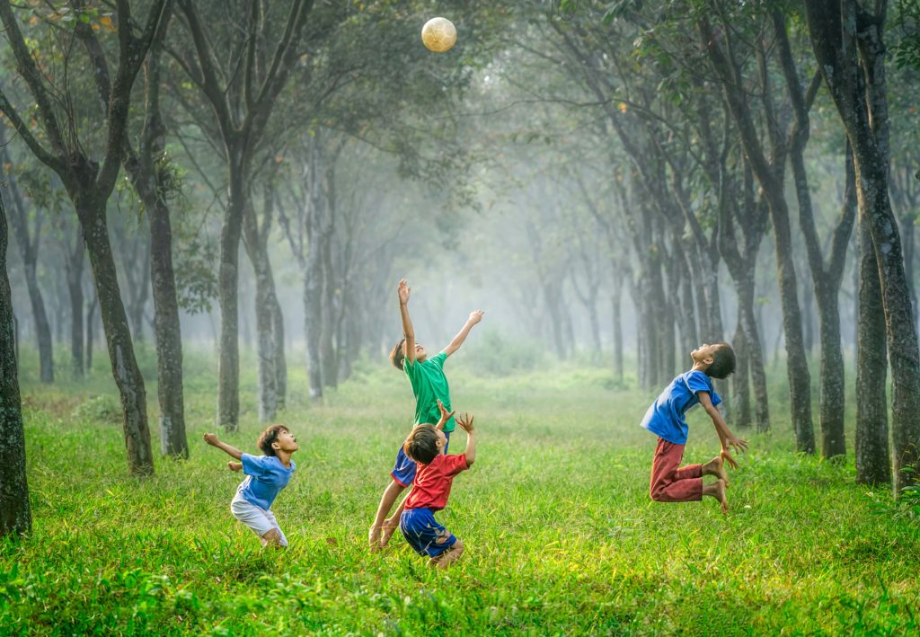 Family Portrait of children playing in the forrest